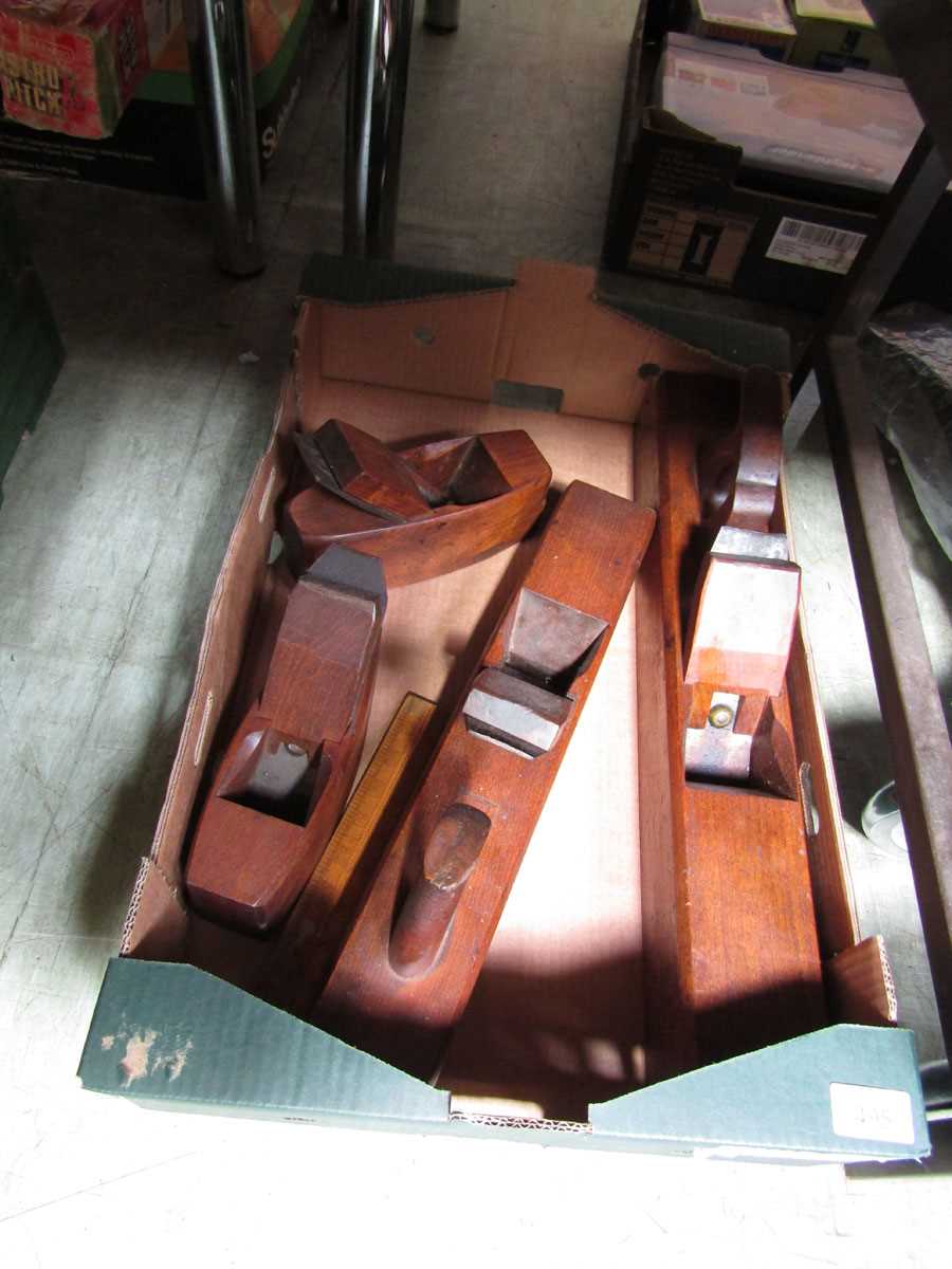 A tray containing a quantity of wooden block planes