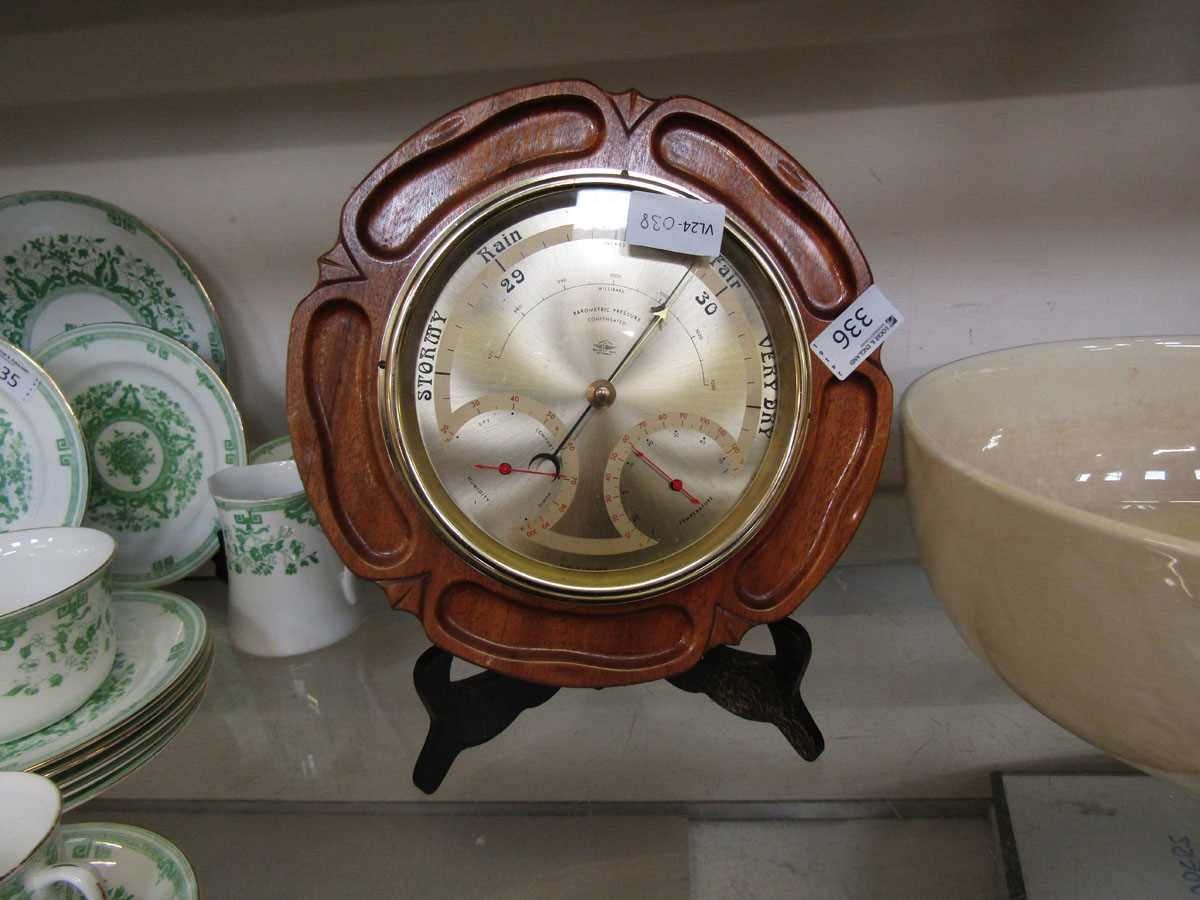 A mahogany cased circular barometer modelled after a flower by Shortland