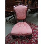 A Victorian possible rosewood spoon back nursing chair