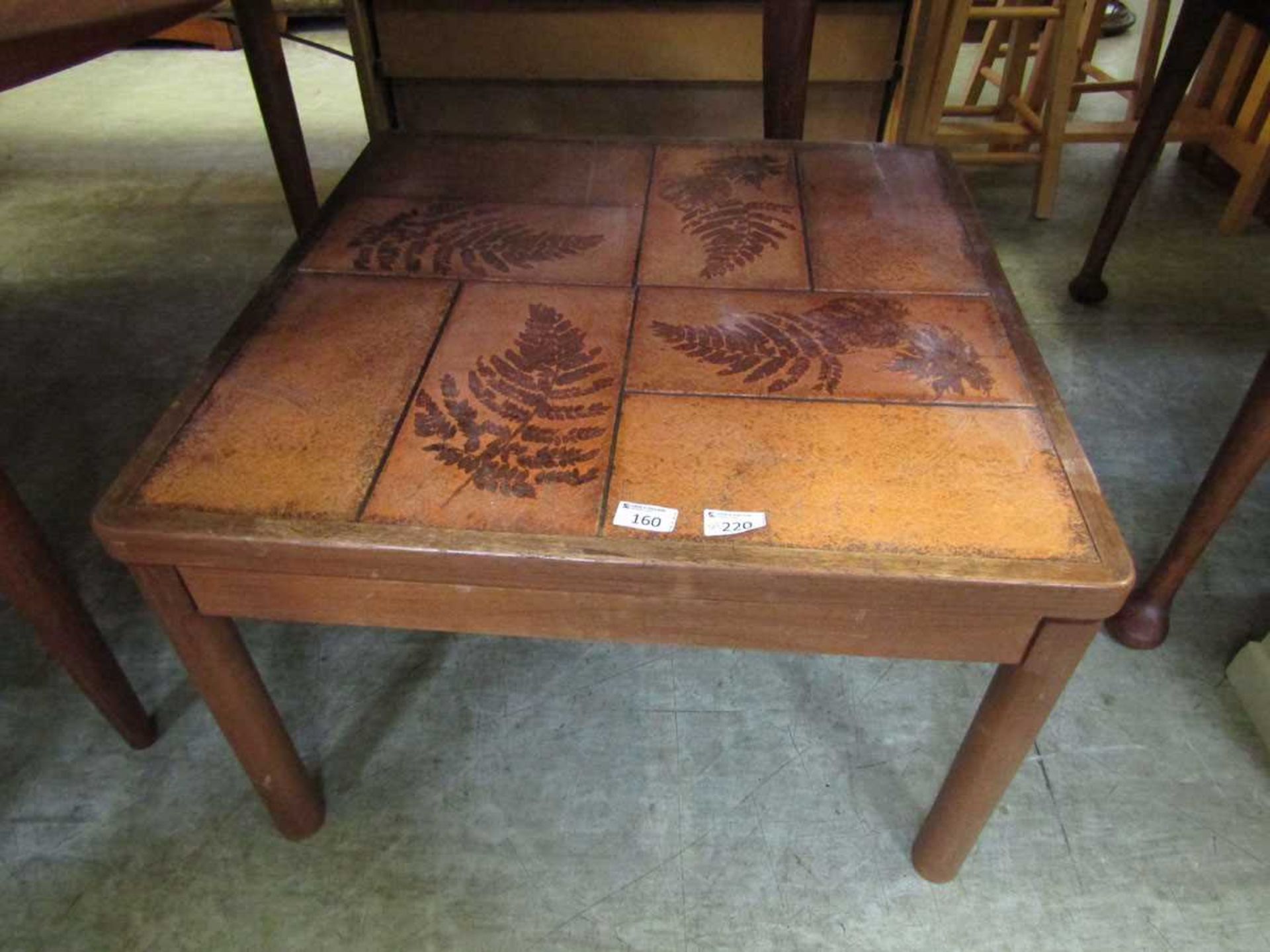 A mid-20th century tile topped occasional table