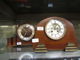 Two mid-20th century style teak cased mantel clocks