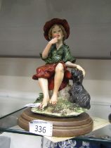 A Capodimonte figurine with certificate on wooden base of young lady with dog