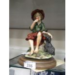 A Capodimonte figurine with certificate on wooden base of young lady with dog