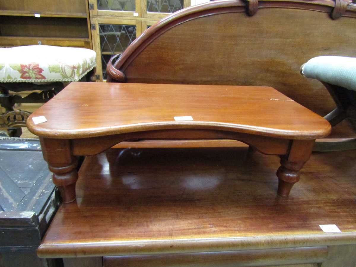 A Victorian mahogany bed table