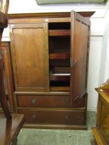 A mid-20th century veneered linen press having two doors with three slides to top, the base having