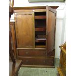 A mid-20th century veneered linen press having two doors with three slides to top, the base having