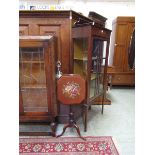 A Victorian mahogany pole screen