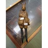 A moulded coat hook in the form of well dressed march hare with horns for legs