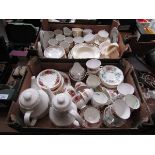 Two trays of decorative ceramic ware to include cups, saucers, teapots, etc