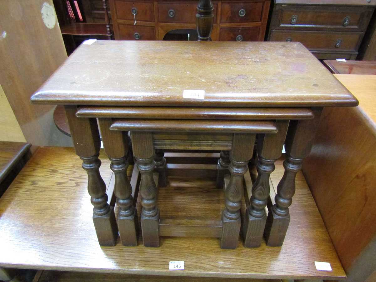 A nest of three Old Charm oak occasional tables