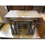 A nest of three Old Charm oak occasional tables