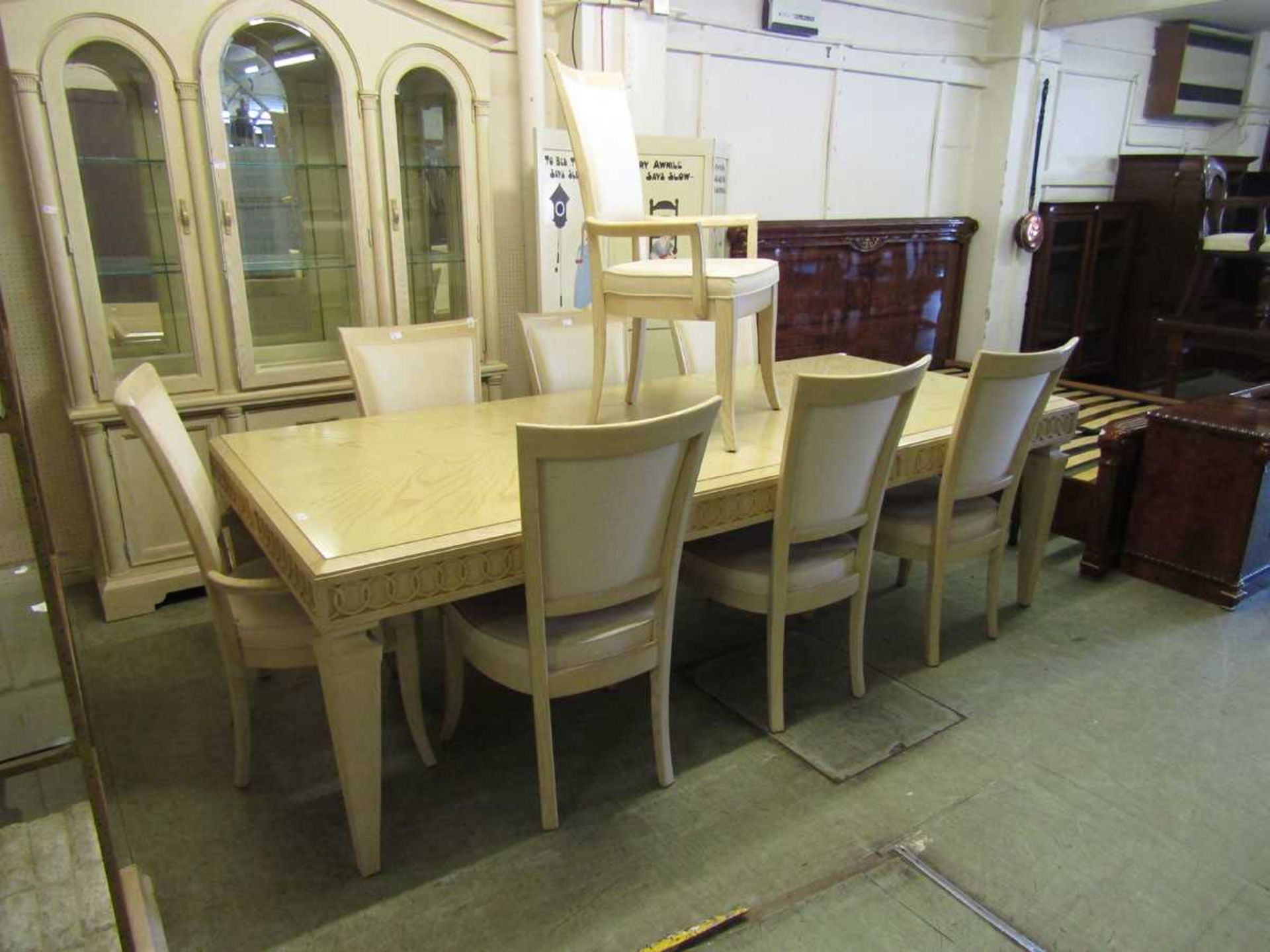 A continental limed oak effect extending dining table with two centre leaves together with a set