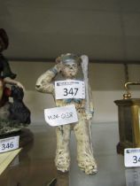 An early 20th century metalwork money box in the form of a sailor