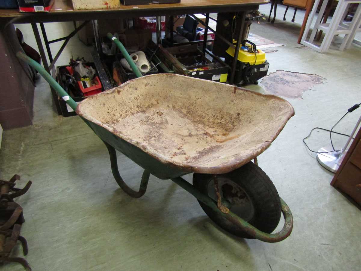 A green metal wheelbarrow