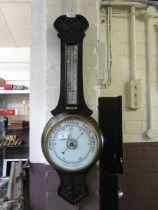 An early 20th century oak banjo aneroid barometer