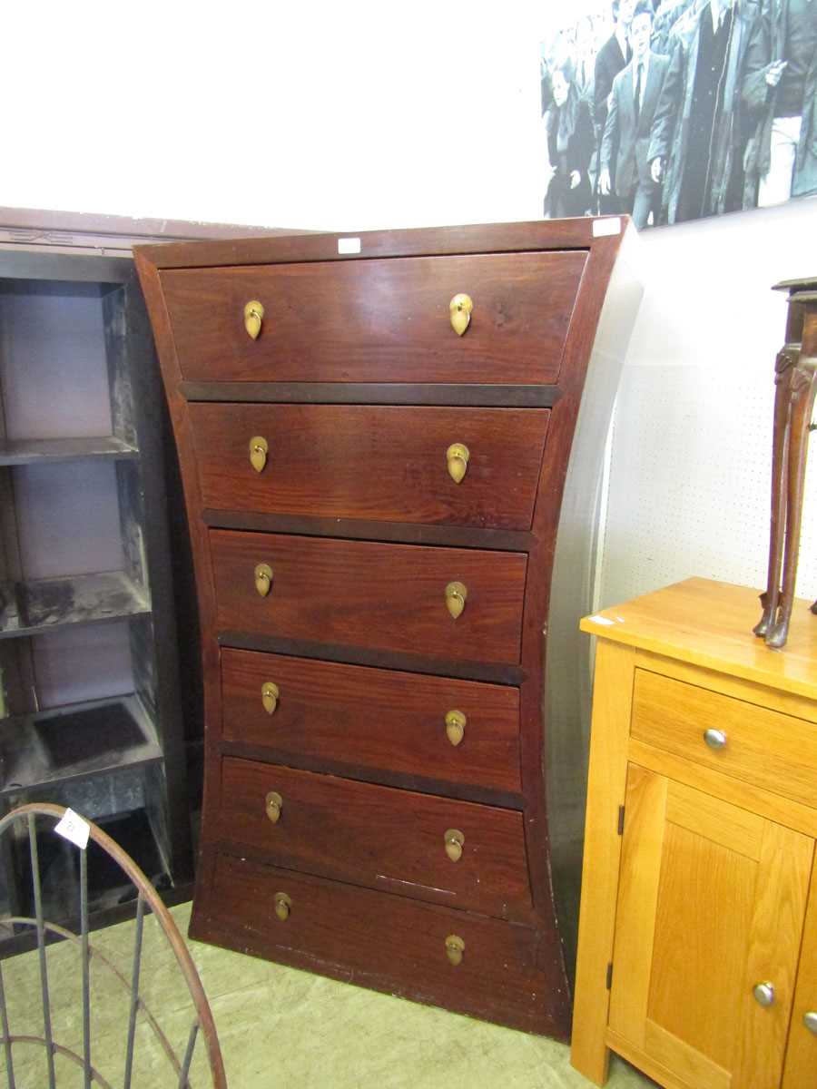 A high quality eastern hardwood six drawer chest having an unusual waisted side
