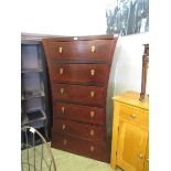 A high quality eastern hardwood six drawer chest having an unusual waisted side