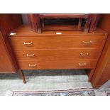 A mid-20th century teak chest of three drawers