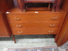 A mid-20th century teak chest of three drawers
