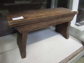 An early 20th century wooden footstool