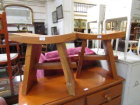 A pair of hand crafted walnut stools