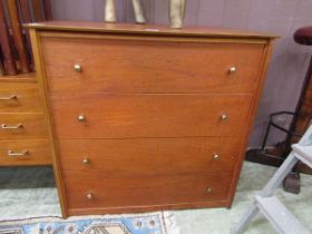 A mid-20th century teak chest of four drawers