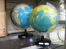 Two globes on stands