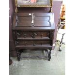 An early 20th century oak fall front bureau