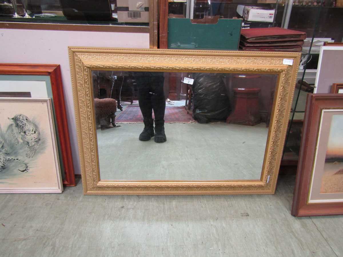 A modern gilt framed bevel glass mirror