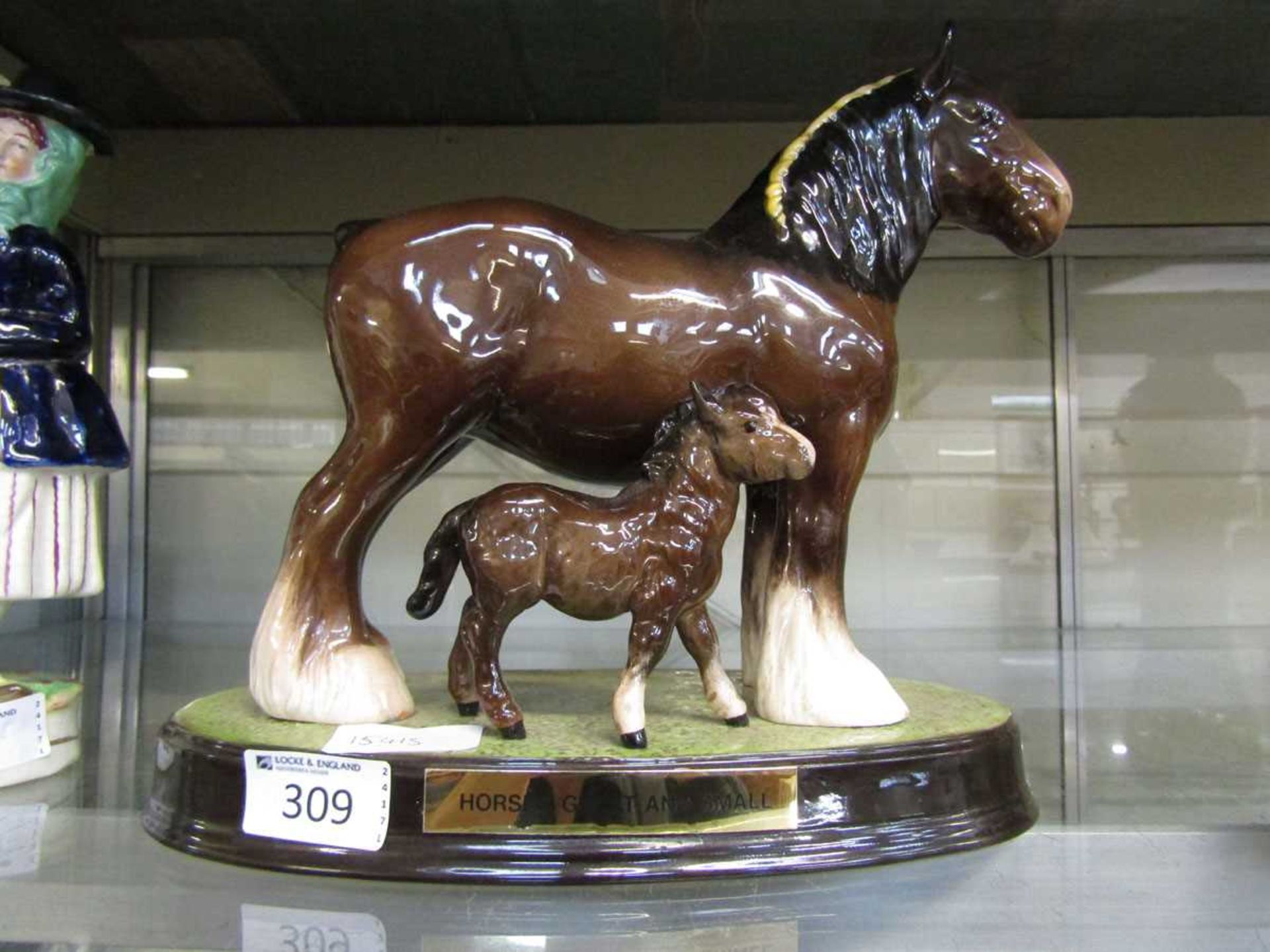 A Beswick ceramic figural group of horse and foal, plaque to base 'Horses Great And Small'