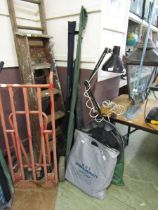 A selection of fishing rods, nets, bait boxes, hooks, etc