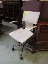 A cream leather and chrome office chair