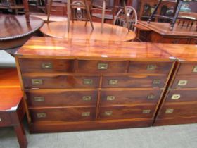 A reproduction campaign style yew cabinet having lift up part top section with dummy drawer design
