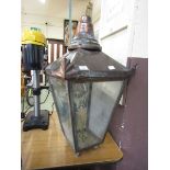 An early 20th century brass and copper four glass lantern