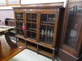 An early 20th century oak glazed bookcase