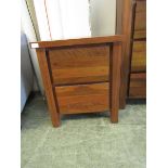 A modern cherrywood two drawer bedside chest