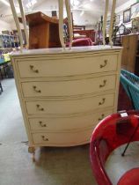 A mid-20th century Queen Anne style serpentine fronted chest of five drawers
