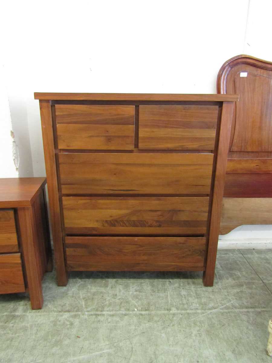 A modern cherrywood chest of two short over three long drawers