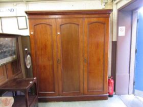 A Victorian mahogany triple wardrobe