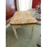 An old pine scrubbed top rectangular table with a painted base
