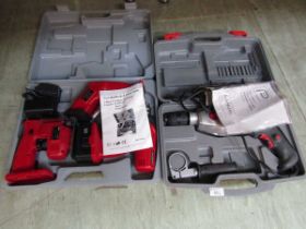 A boxed electric hammer drill together with a boxed three in one three piece cordless tool pack