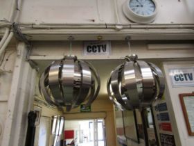 A pair of modern steel light fittings