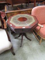 A reproduction octagonal drum table