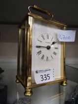 A brass and five glass carriage clock by Dominion on brass bun feet