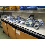 A large assortment of oriental style blue and white ceramic tableware to include meat plates,