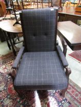 An early 20th century mahogany framed reclining chair having a modern upholstered seat and back