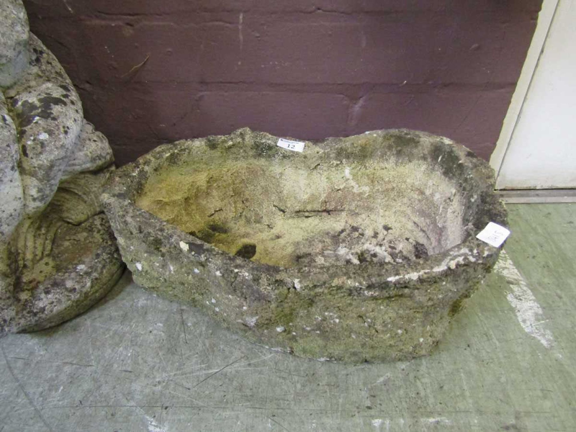 A weathered stoneware trough