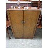 A mid-20th century walnut veneered gentlemen's two door wardrobe