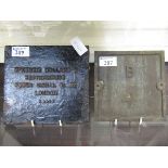 Two cast metal signs, one being Mackenzie Holland and Westinghouse, the other having ambossed