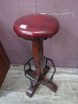 A reproduction wood and metalwork stool